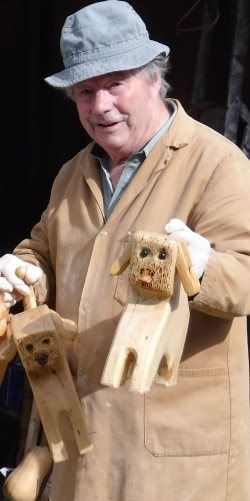 griff carrying three hounds off by their tails to varnish them